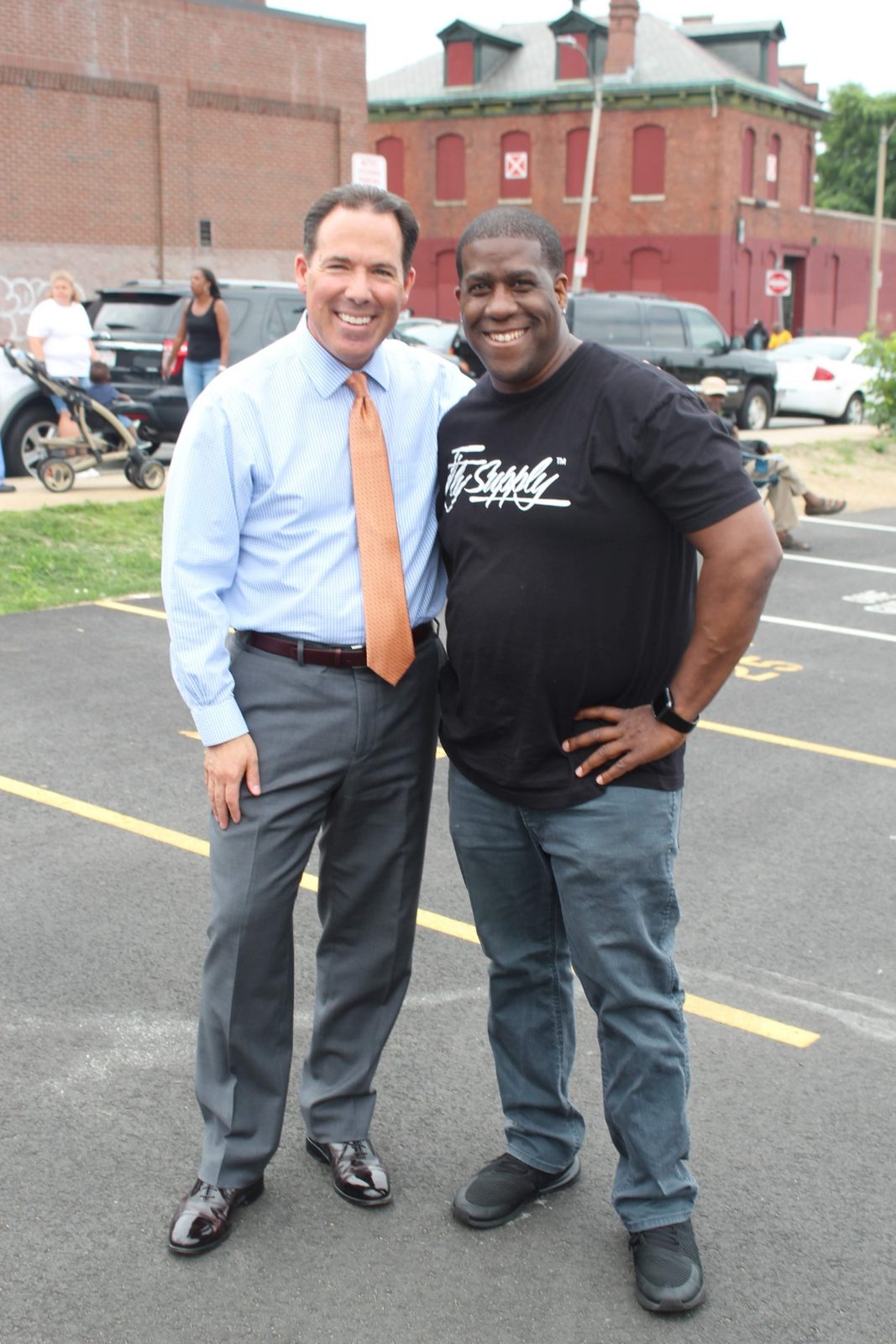 Shawn B. Hunter with Robert F. Rivers, Executive Chair of Eastern Bank, at an outdoor Boston community event