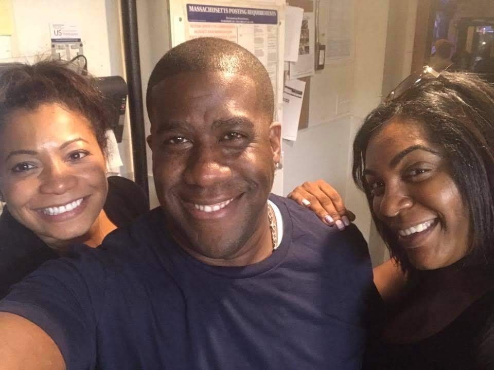 Shawn B. Hunter with two team members in the back of house at Slade's Bar and Grill in Boston