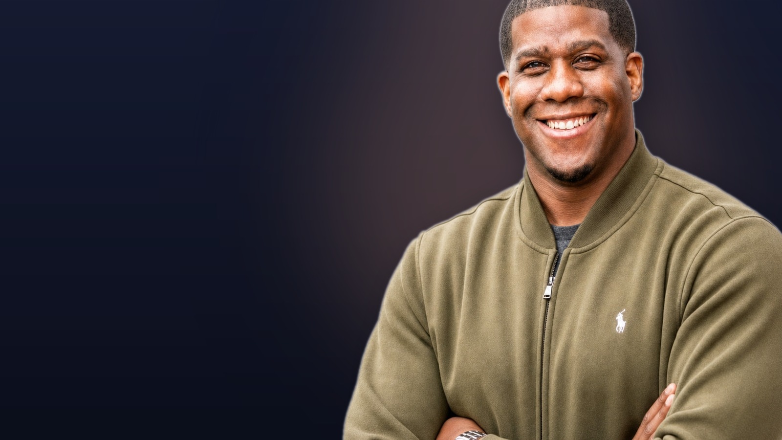 Shawn B. Hunter, founder of Inspired Culinary Collective, smiling with arms crossed