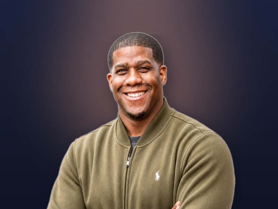 Shawn B. Hunter, founder of Inspired Culinary Collective, smiling with arms crossed